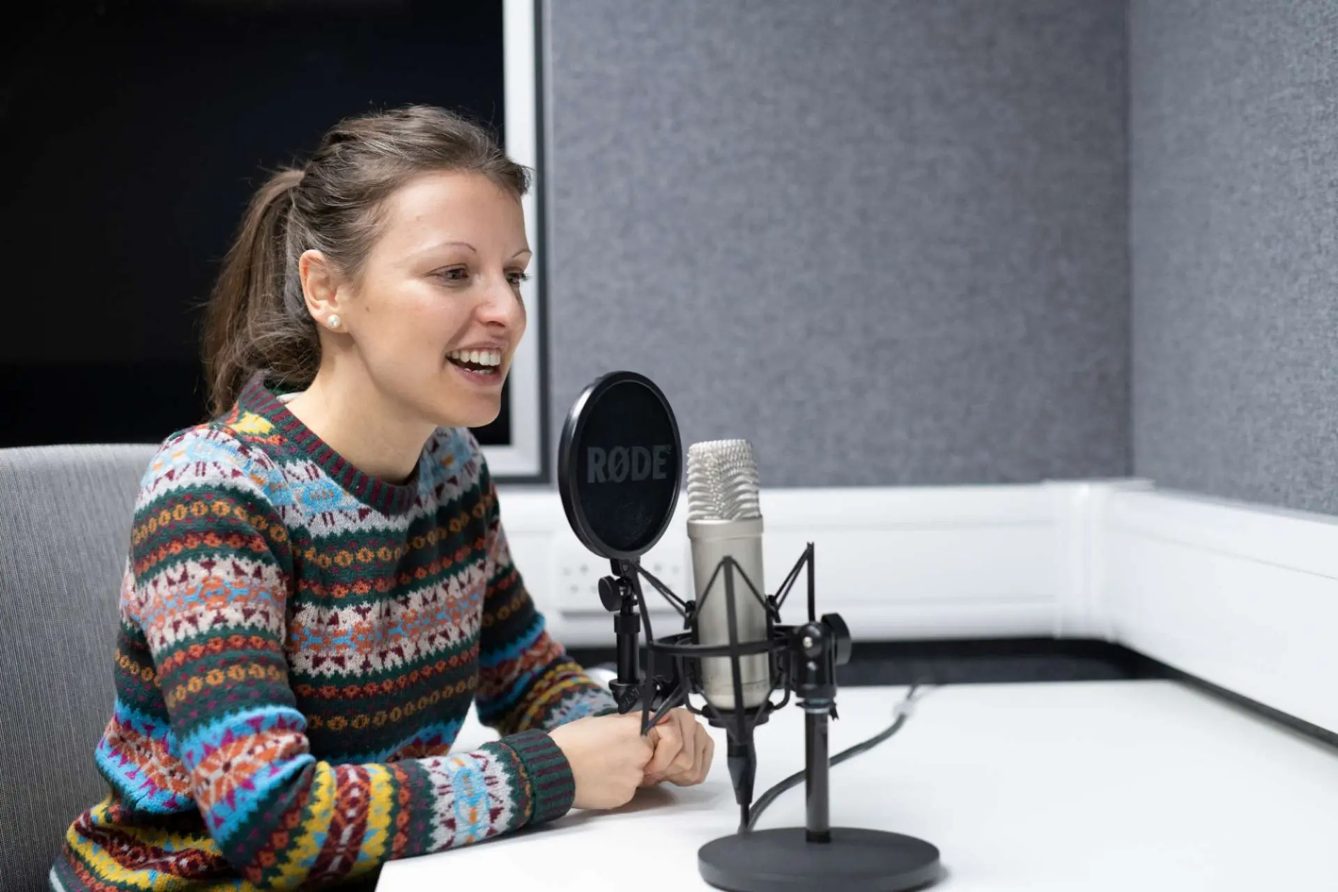 English Language Student at a Microphone.